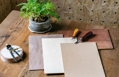 Wood, acrylic, and leather samples cut with a FLUX laser