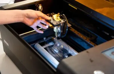 FLUX laser head engraving a workpiece