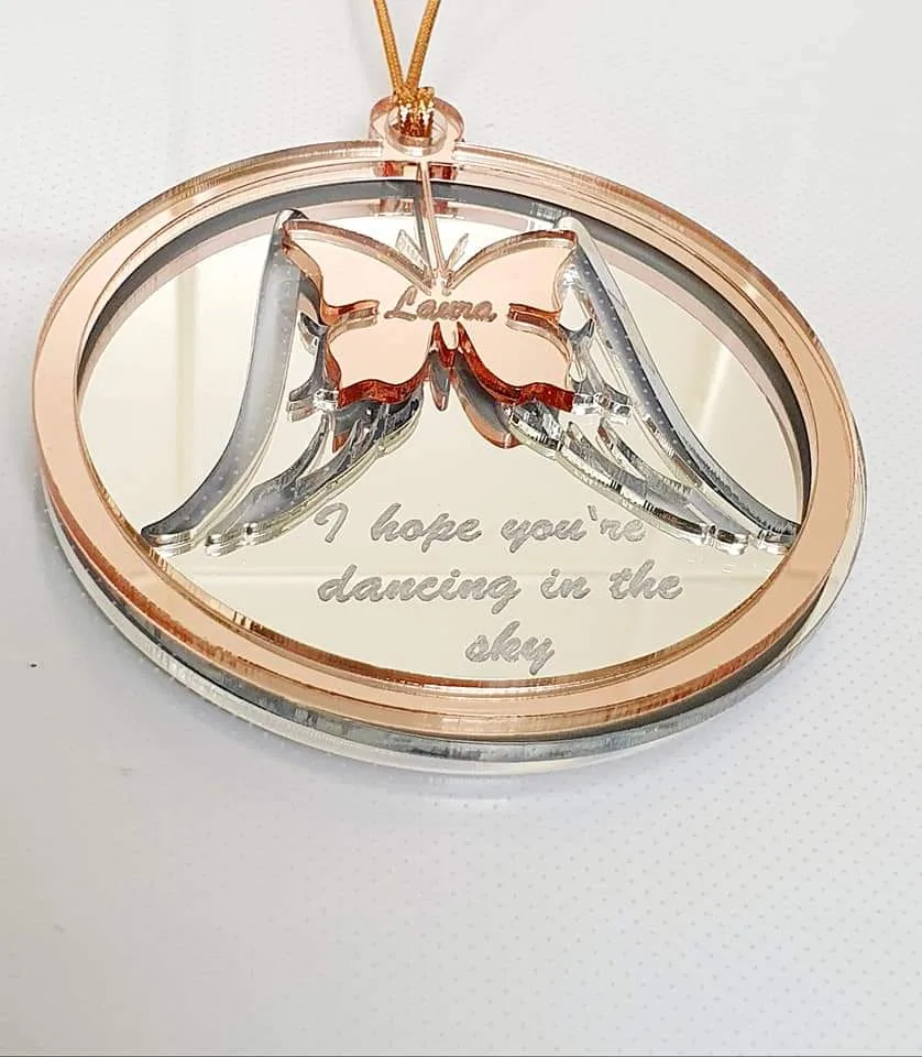 A layered mirrored-acrylic memorial Christmas ornament made by Linda