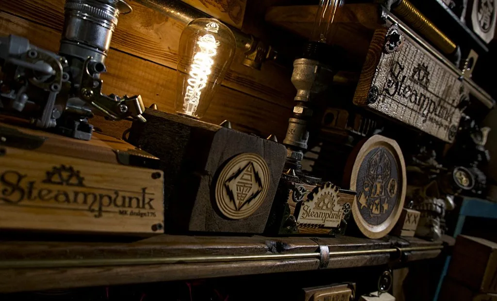 Laser-engraved MK Design signs and a glowing handmade lamp display