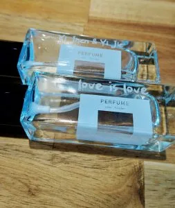 Two rectangular perfume bottles personalized with laser engraving