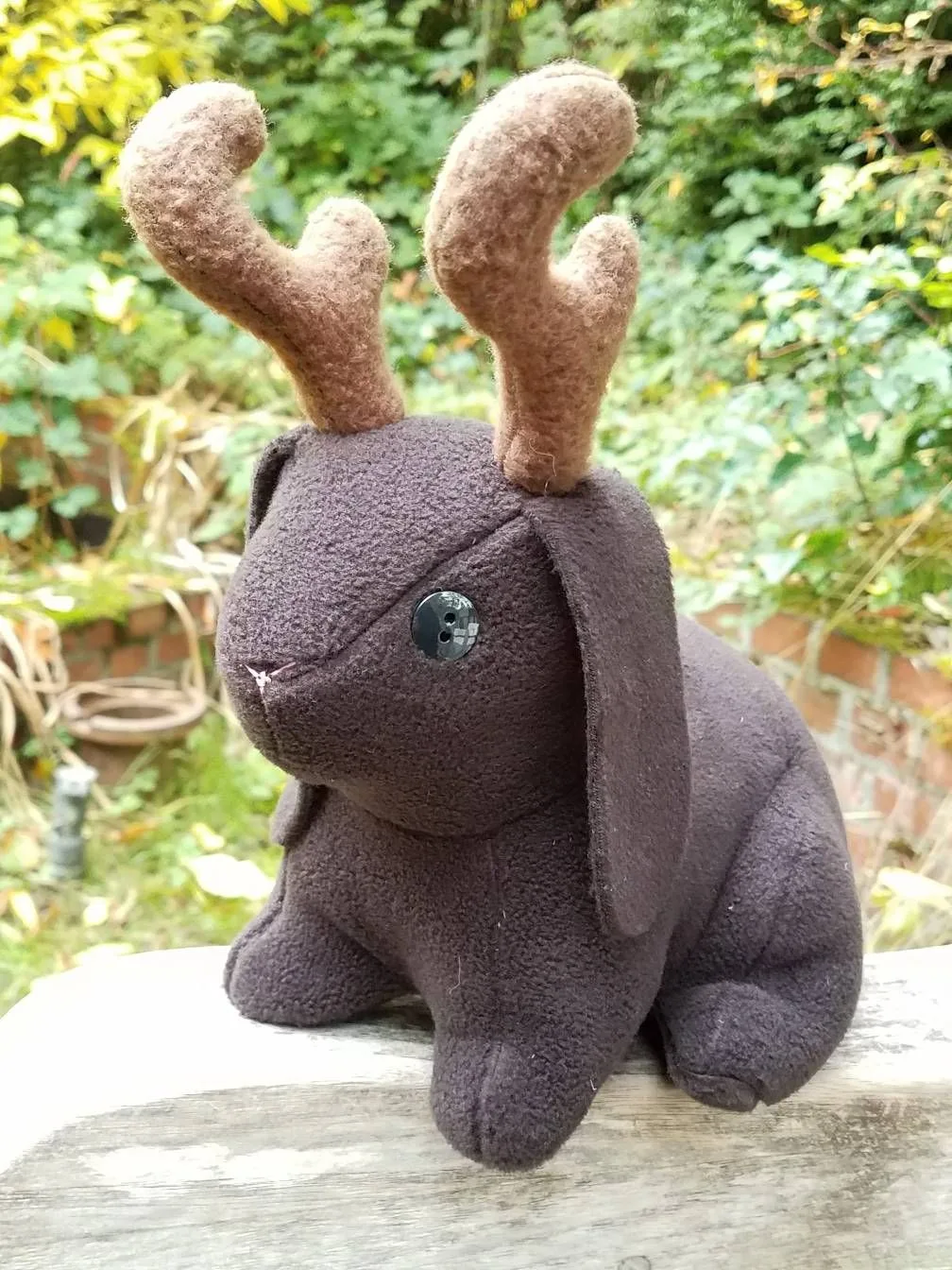 A handmade jackalope whose small antler pieces were cut with beamo